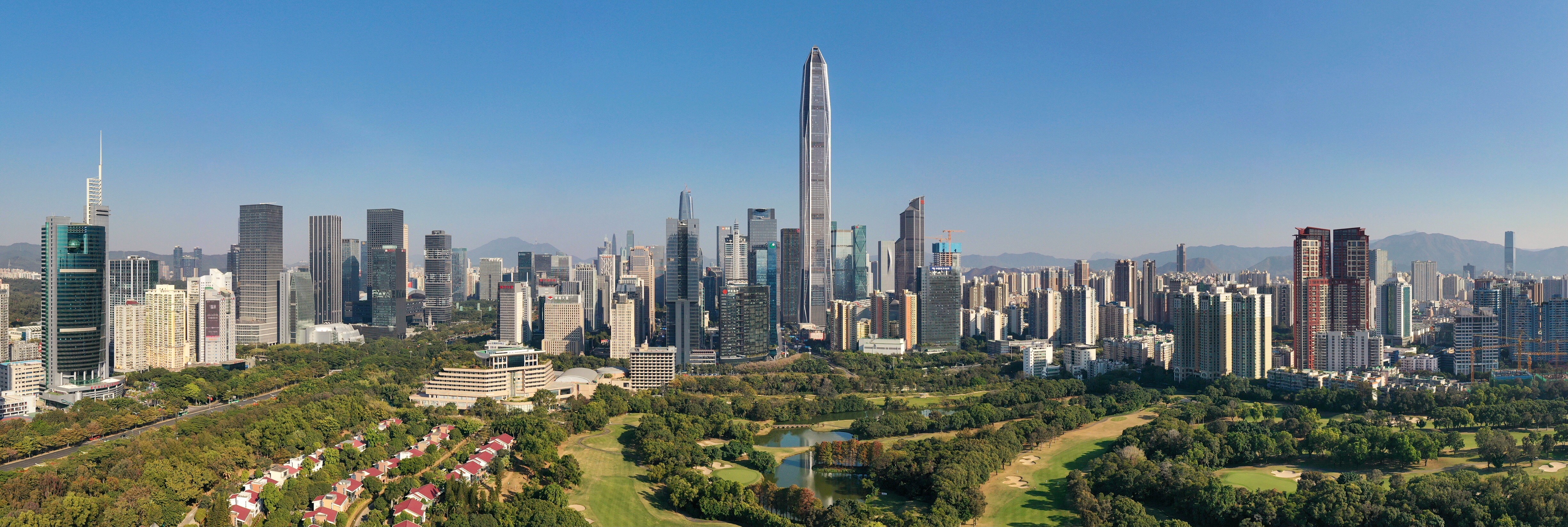 Shenzhen skyline above green parkland